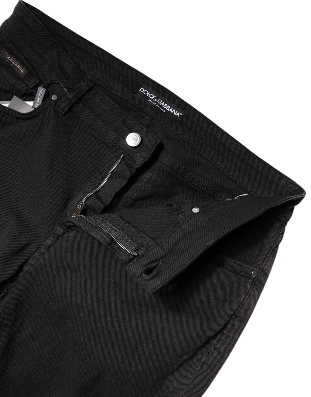 Jean skinny en denim noir à taille haute de Dolce & Gabbana, en coton, ajusté et tendance, visible en détail dans l'image.
