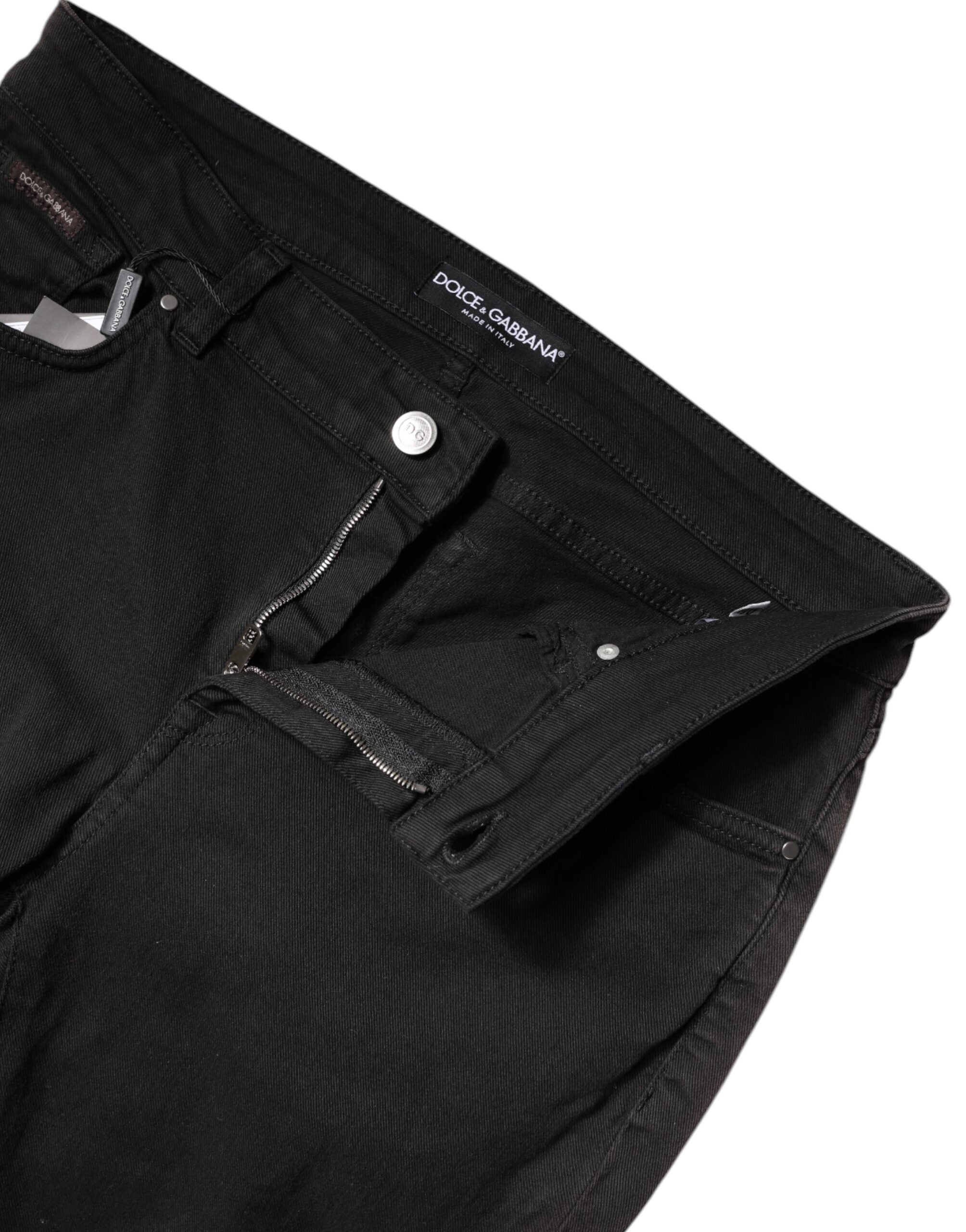Jean skinny en denim noir à taille haute de Dolce & Gabbana, en coton, ajusté et tendance, visible en détail dans l'image.