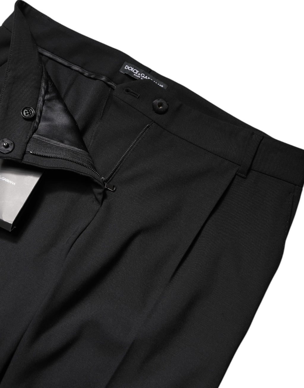 Pantalons habillés en laine noire Dolce & Gabbana à taille haute et coupe boot cut, détails élégants et sophistiqués.