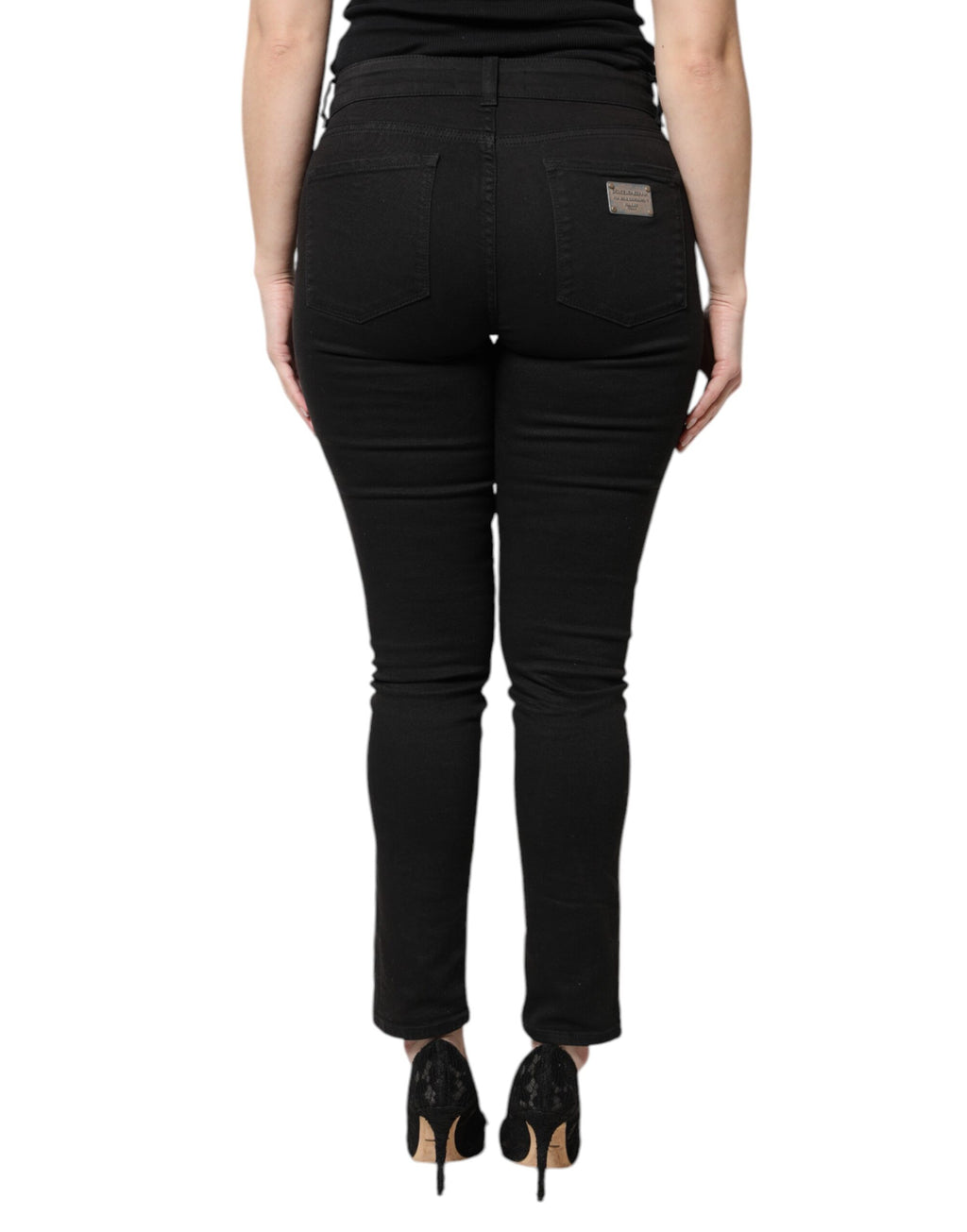Jeans skinny en denim noir Dolce & Gabbana en coton à taille haute, vue de face.