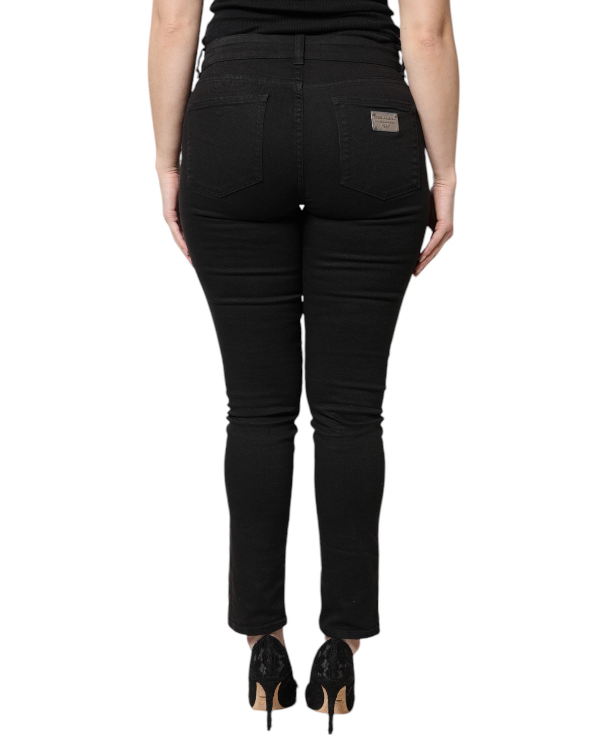 Jeans skinny en denim noir Dolce & Gabbana en coton à taille haute, vue de face.