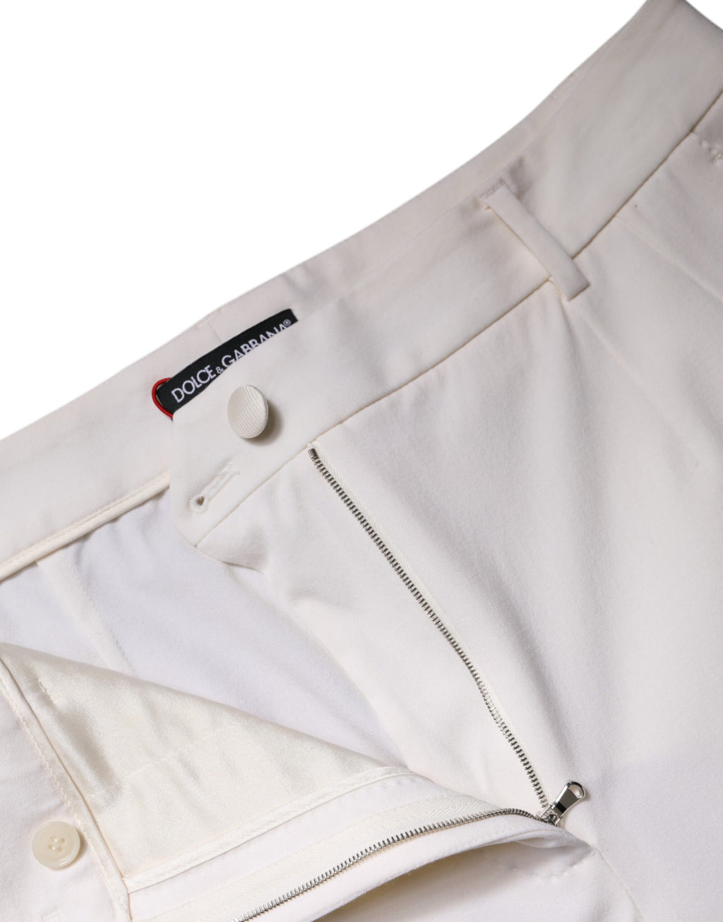 Pantalons larges en laine blanche Dolce & Gabbana, taille moyenne, coupe fluide et élégante, vue de face.