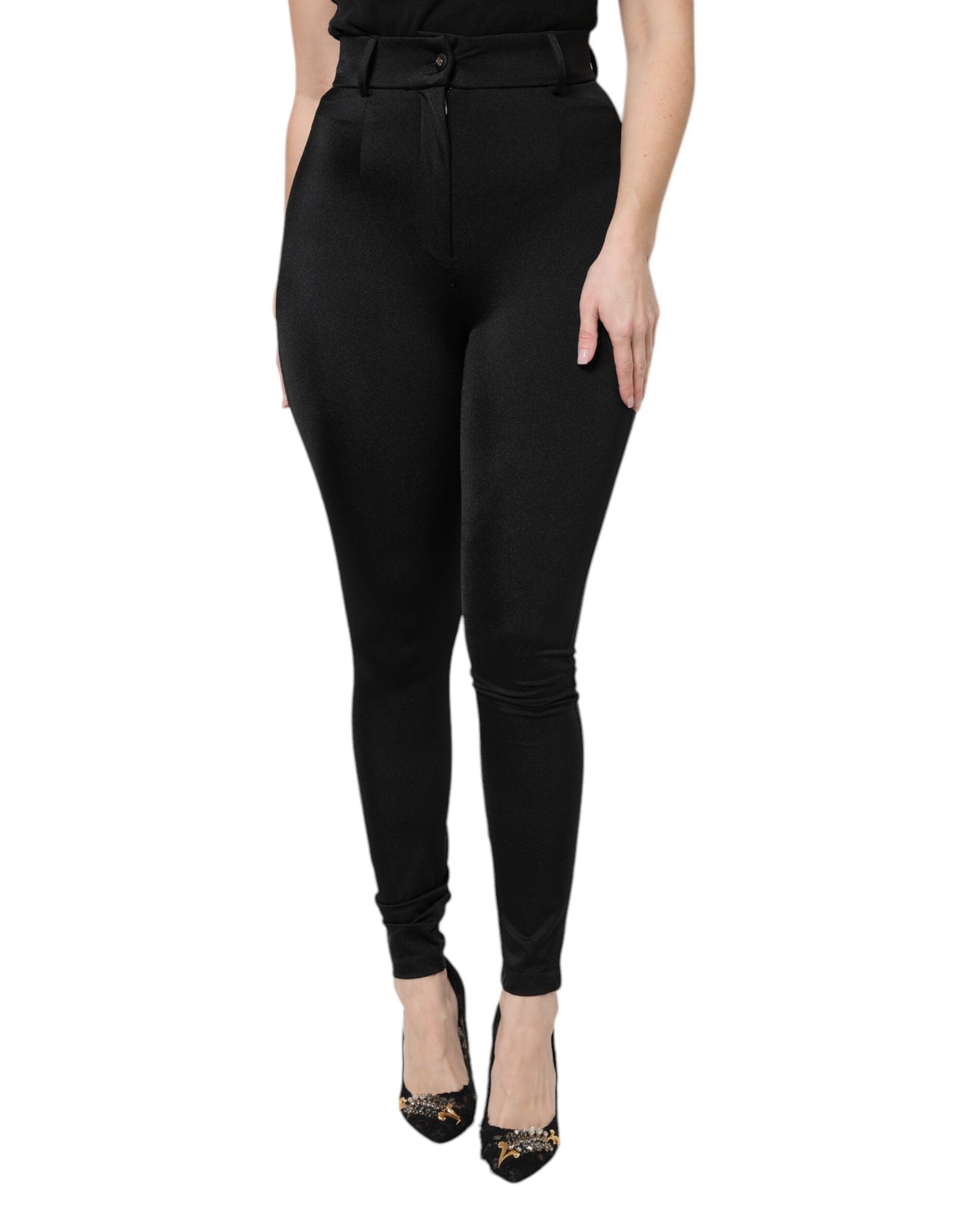Pantalon noir en nylon à taille haute et coupe slim de Dolce & Gabbana, vue de face.