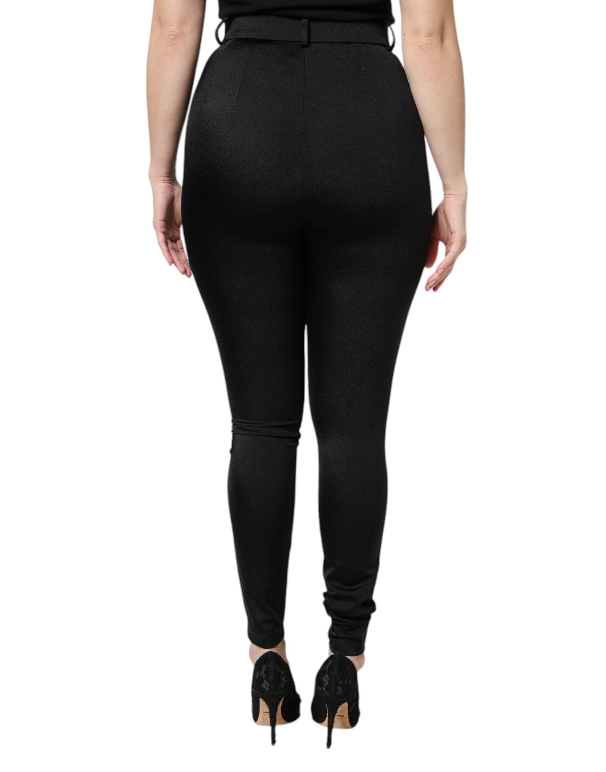 Pantalons noirs en nylon à taille haute et coupe slim de Dolce & Gabbana, visibles sur l'image.