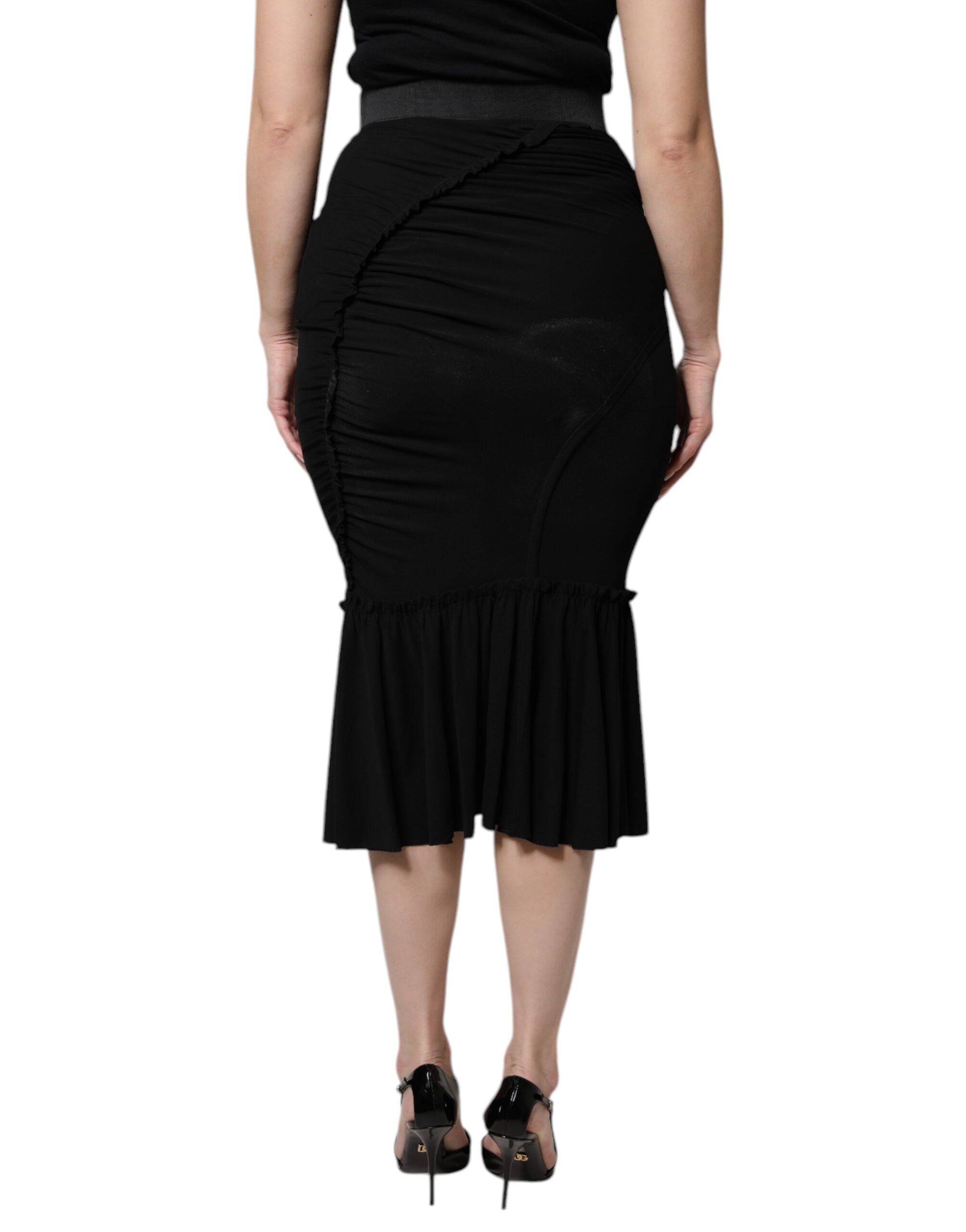 Jupe midi noire en coupe sirène à taille haute de Dolce & Gabbana, élégante et moulante, en tissu fluide.