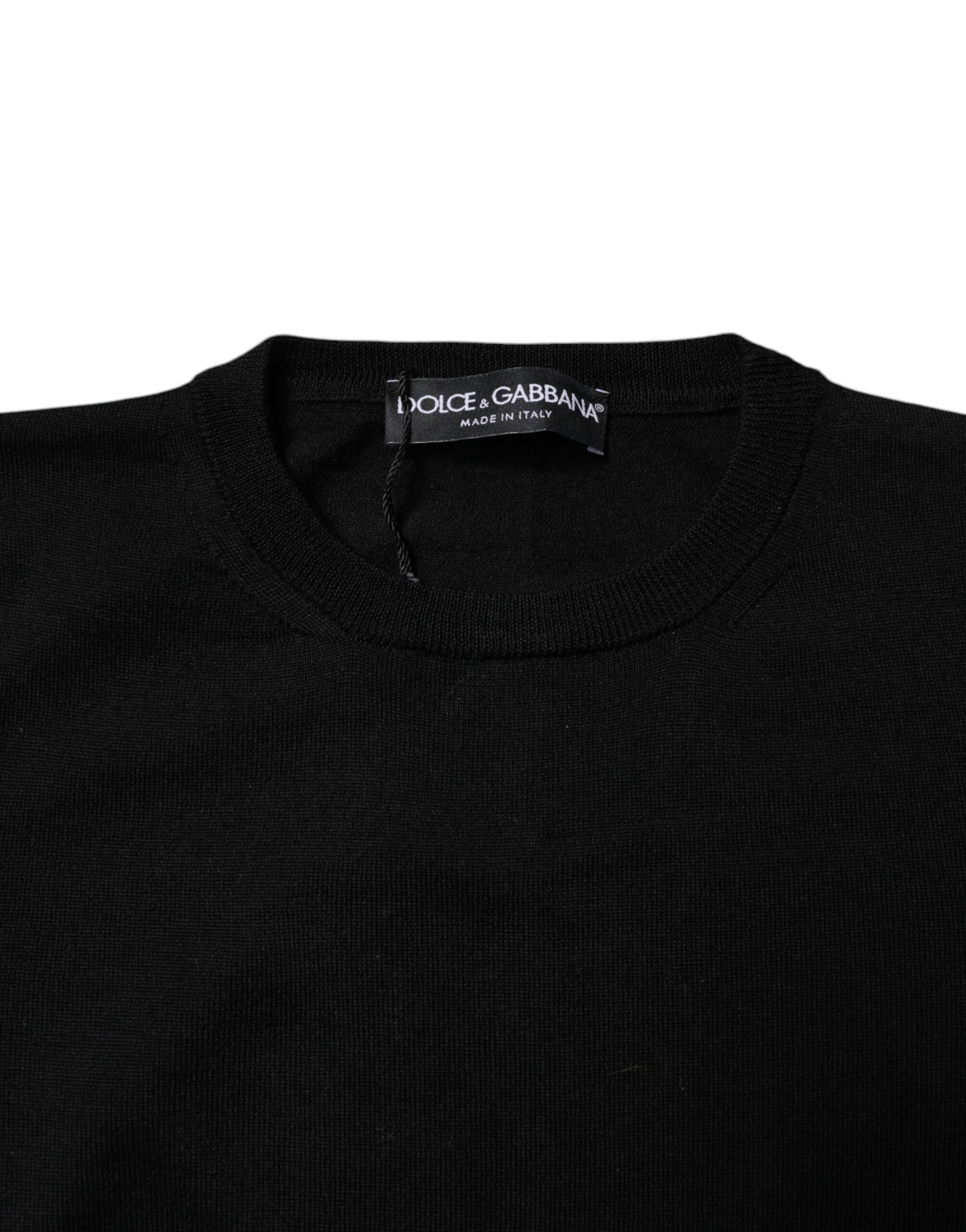 Pull en laine noir Dolce & Gabbana à col rond, texture tricotée, élégant et confortable, pour un look sophistiqué.
