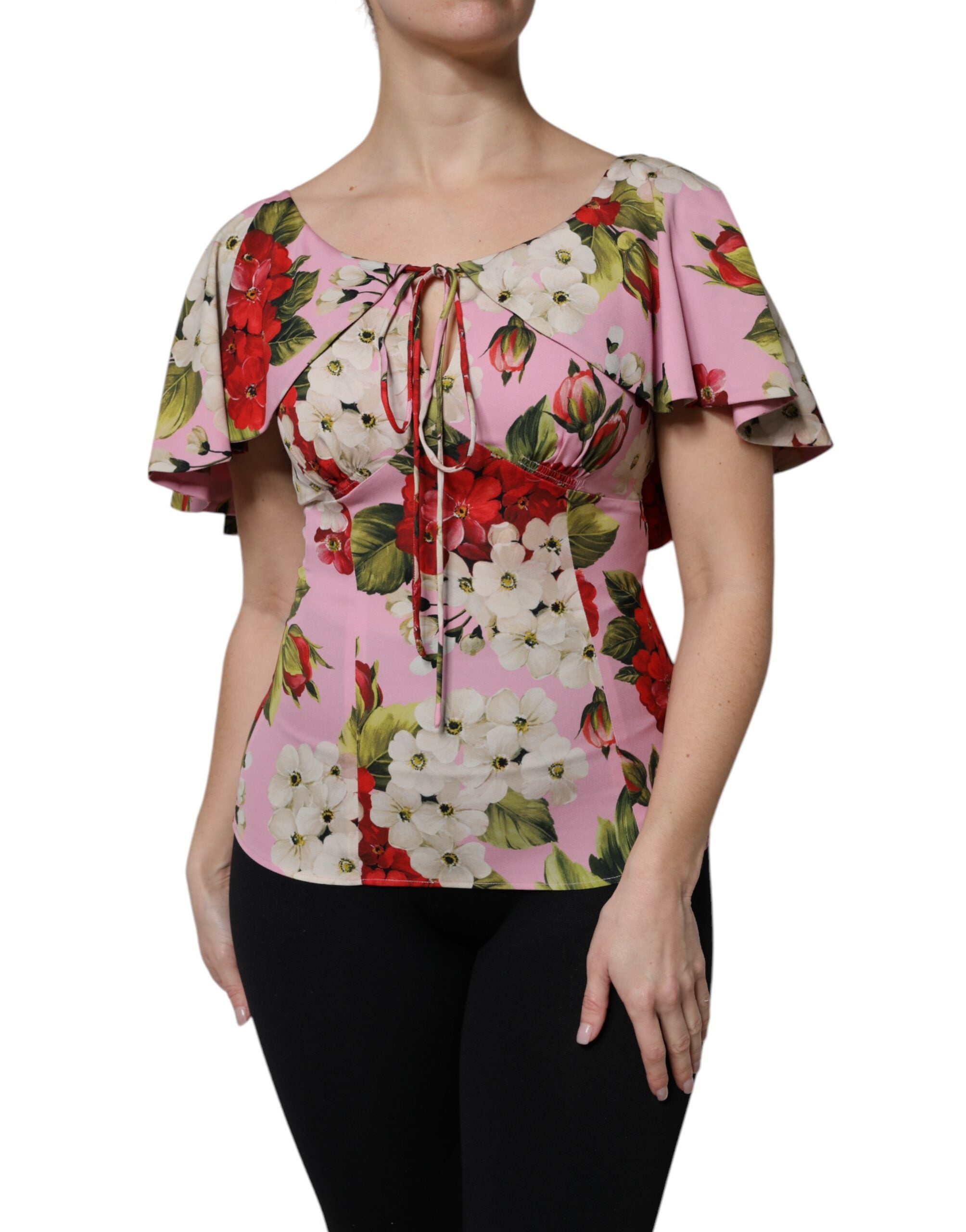 Blouse Dolce & Gabbana en soie rose avec motifs floraux à manches courtes, élégante et légère, vue de face.