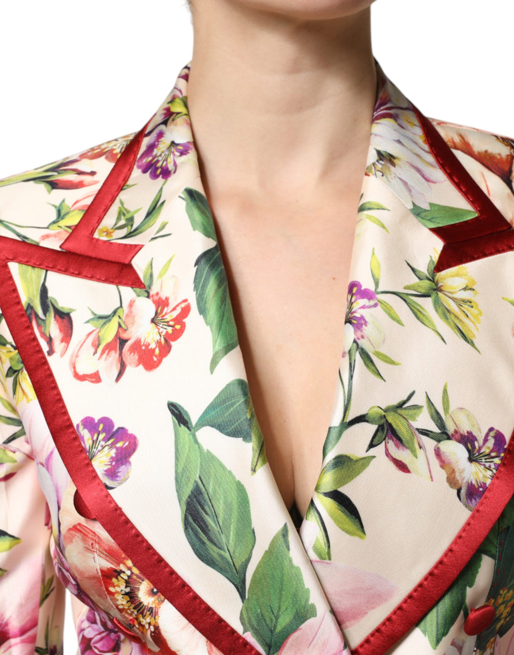 Veste à fleurs multicolores Dolce & Gabbana à double boutonnage, style élégant et sophistiqué, motif floral vibrant.
