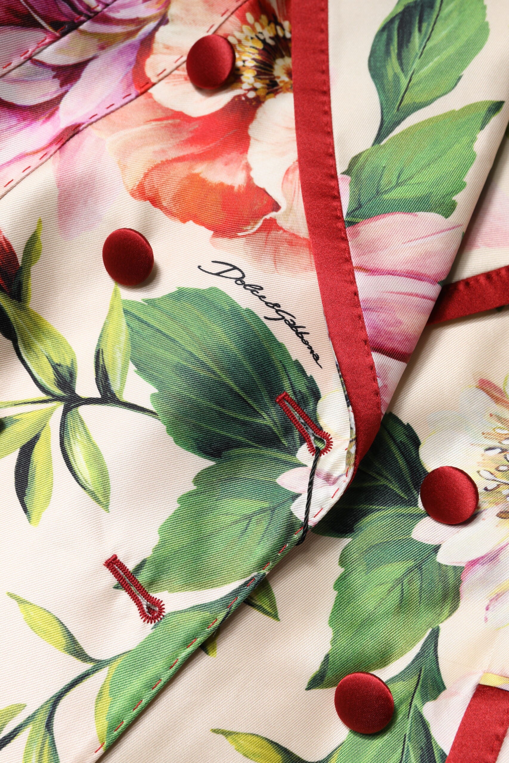 Veste à fleurs multicolores à double boutonnage Dolce & Gabbana, design élégant et coloré, vue de face.