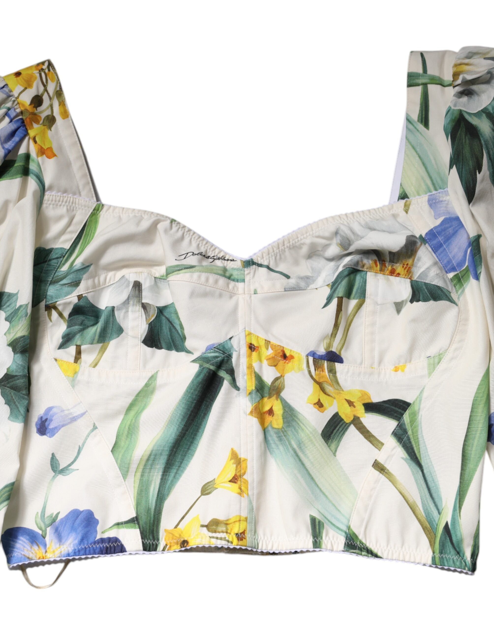 Chemisier crop blanc à fleurs Dolce & Gabbana avec manches bouffantes, vue de face sur fond neutre.