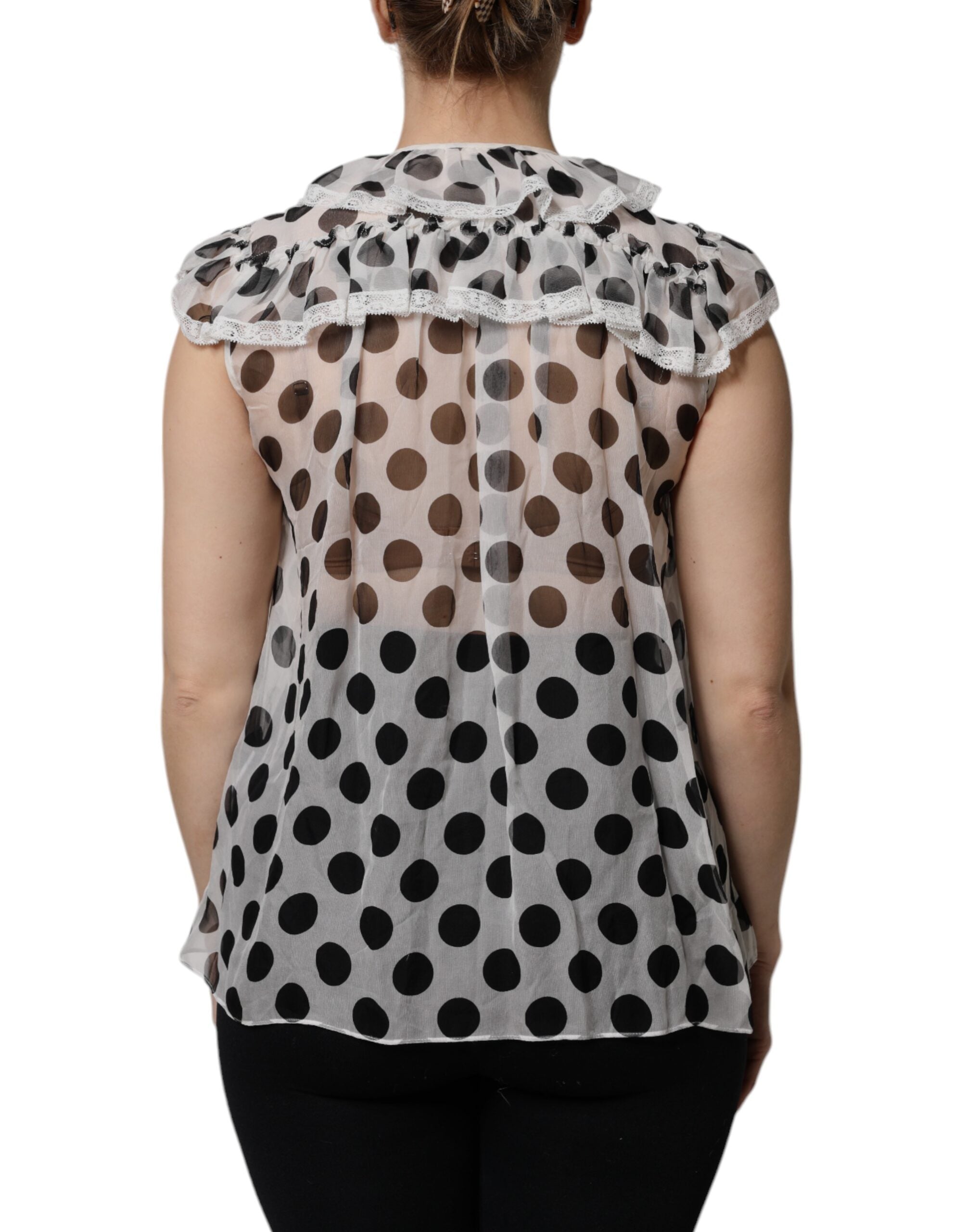Haut sans manches en coton blanc et noir à pois de Dolce & Gabbana, style élégant et léger.