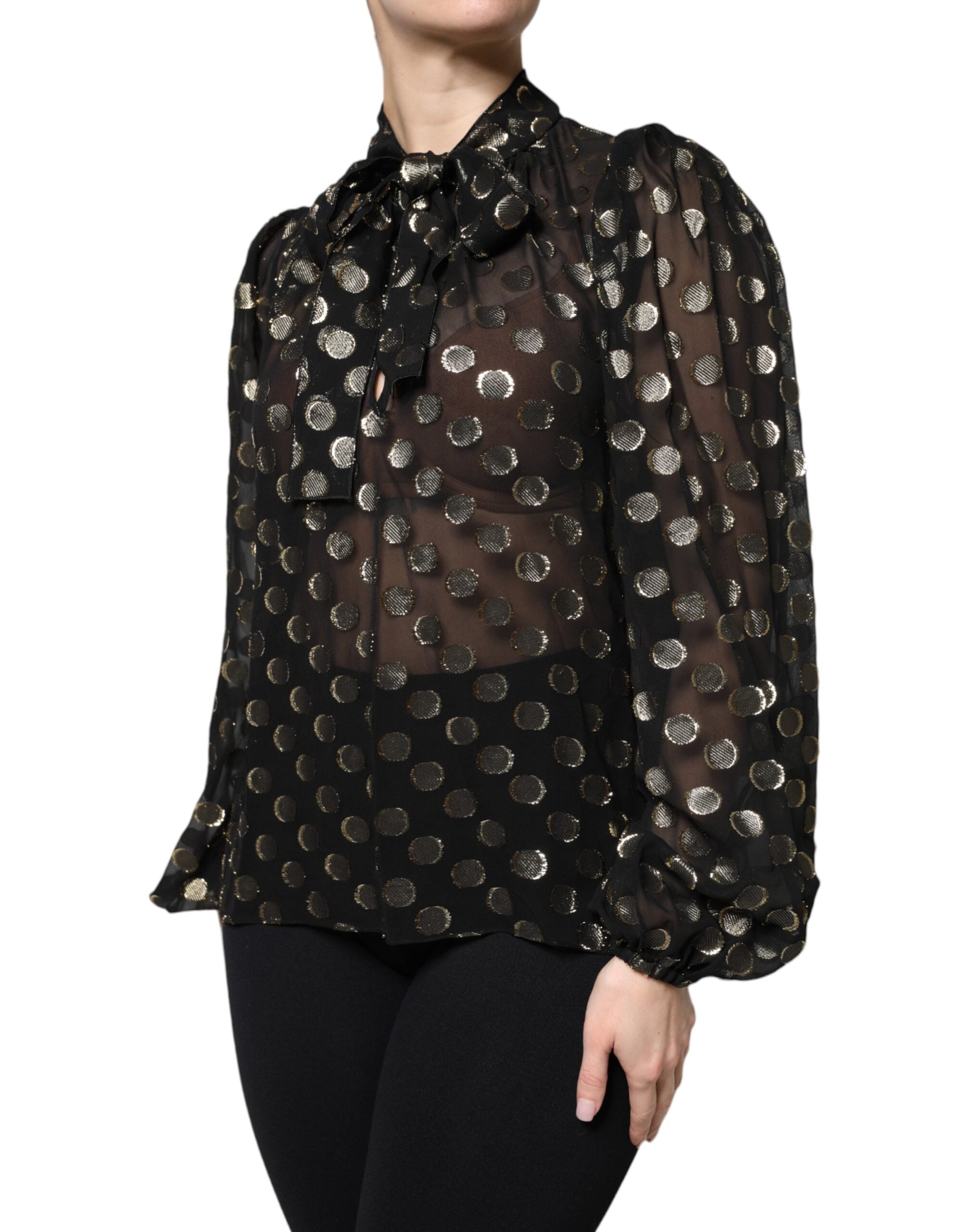 Chemisier noir en tulle à pois avec col à nouer Dolce & Gabbana, élégant haut à manches longues.