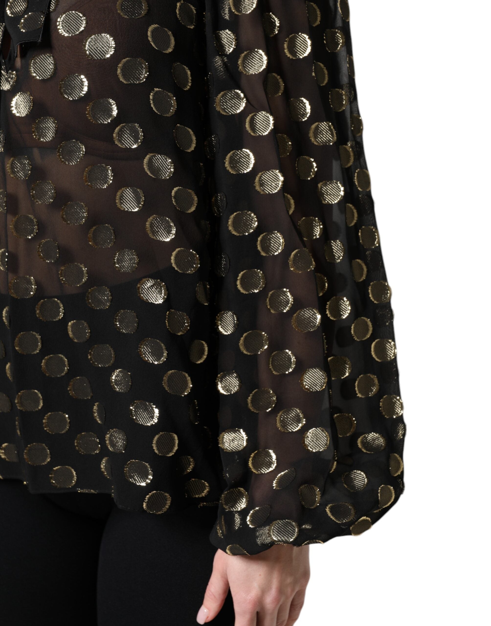 Chemise noire en dentelle transparente Dolce & Gabbana avec collier à nouer et motif à pois, pour un look élégant et sophistiqué.