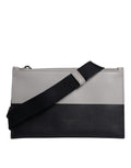 Sac bandoulière en cuir noir et blanc Dolce & Gabbana avec logo embossé, style élégant et sophistiqué.
