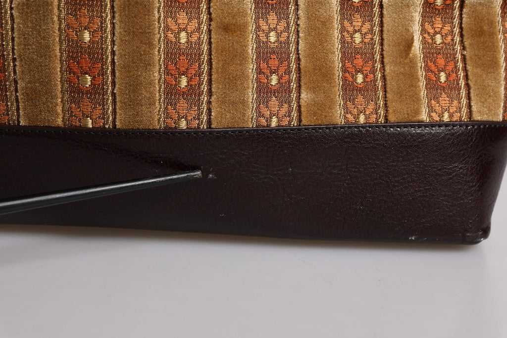 Sac de voyage Dolce & Gabbana en velours beige et bordeaux avec cuir et jacquard, élégant et spacieux.