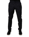 Pantalon formel en coton bleu foncé de coupe tapered par Dolce & Gabbana, détail élégant et tissu de haute qualité.