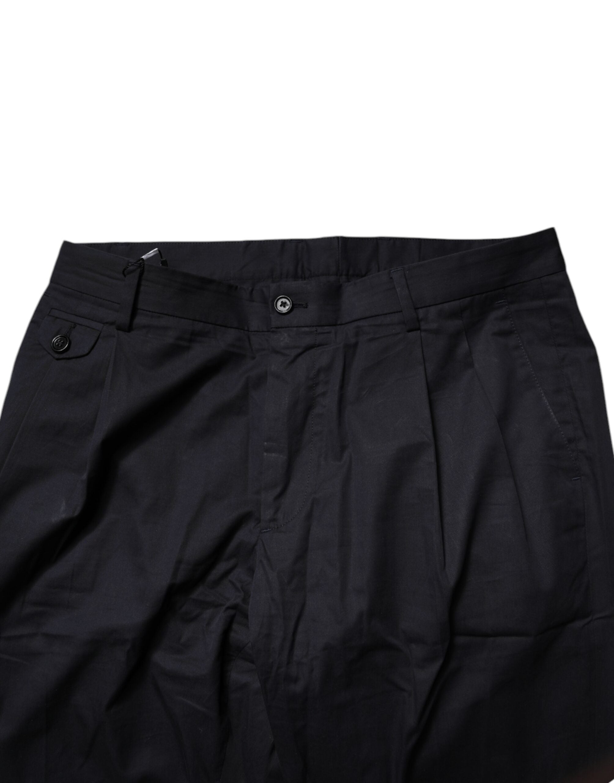 Pantalon formel bleu foncé en coton de style tapered de la marque Dolce & Gabbana, visible avec une coupe ajustée.