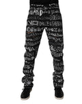 Jeans droits en denim noir Dolce & Gabbana avec logo imprimé en coton, visible en détail sur l'image.