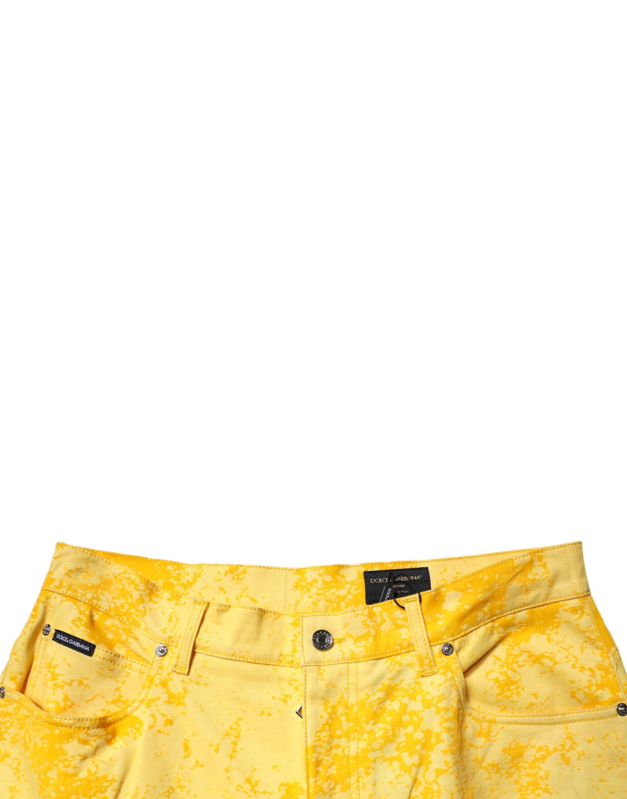 Jeans en denim droit jaune tie-dye en coton de Dolce & Gabbana, visibles avec leur motif coloré et coupe classique.