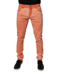 Jean skinny en coton tie-dye orange de Dolce & Gabbana pour homme, denim avec style coloré et ajusté.