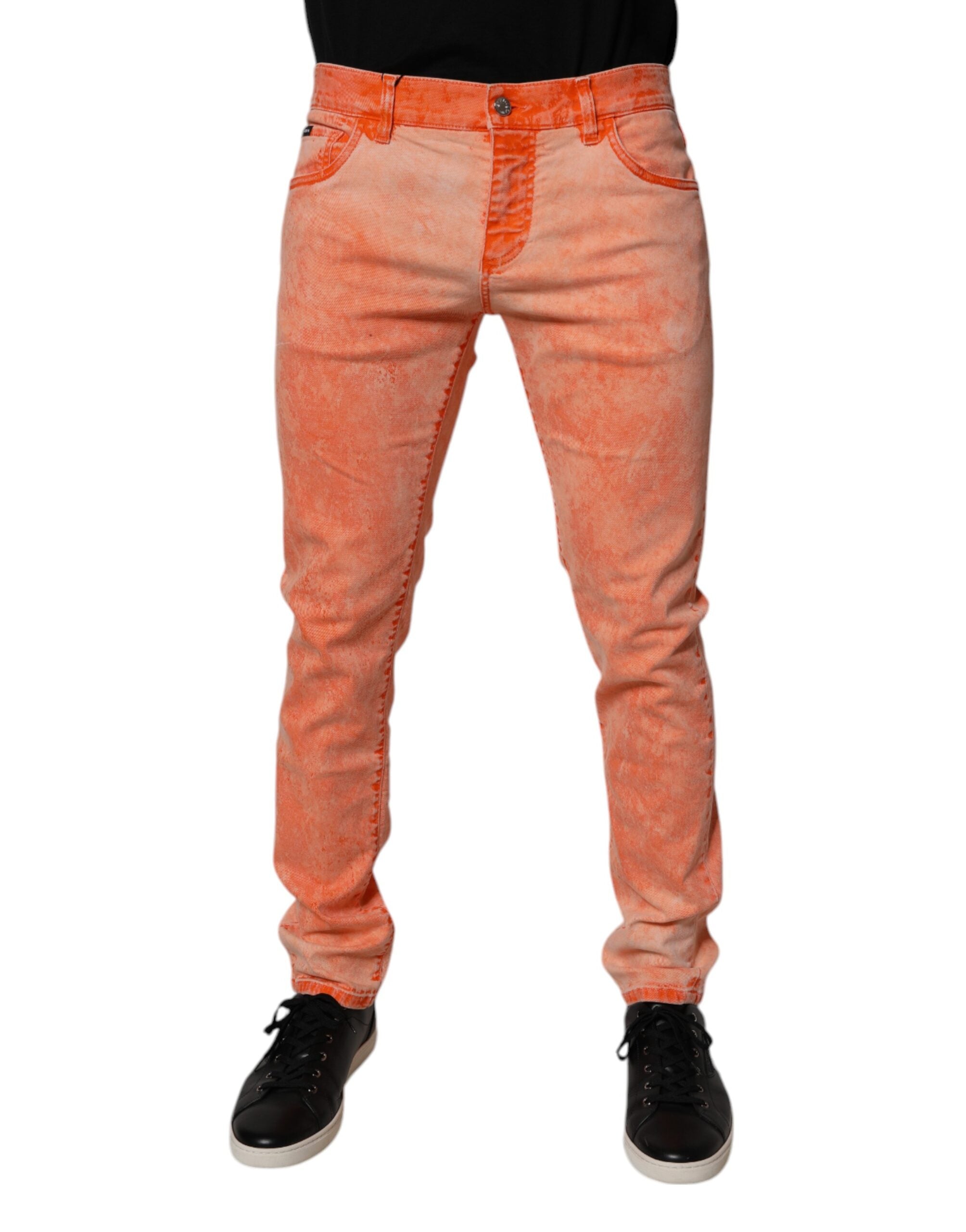 Jean skinny en coton tie-dye orange de Dolce & Gabbana pour homme, denim avec style coloré et ajusté.