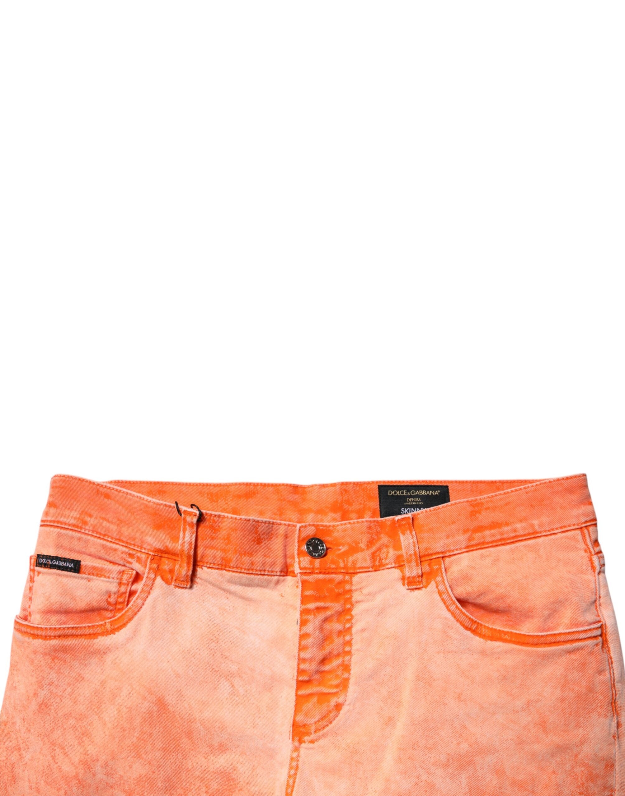 Jeans slim en coton tie-dye orange de Dolce & Gabbana pour homme, denim bleu avec style décontracté.