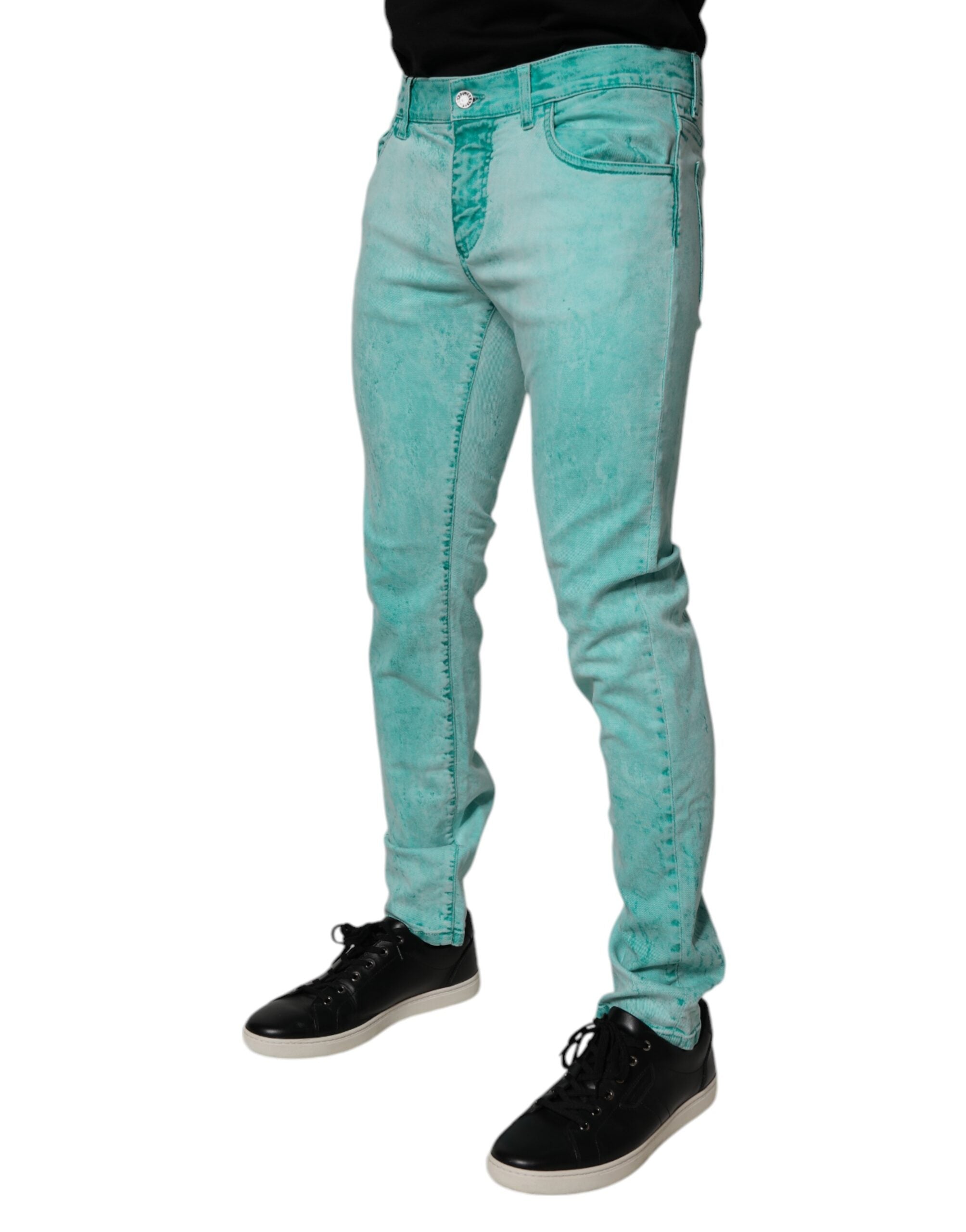 Jeans homme slim Dolce & Gabbana en coton tie-dye vert, denim skinny avec détails modernes et style décontracté.