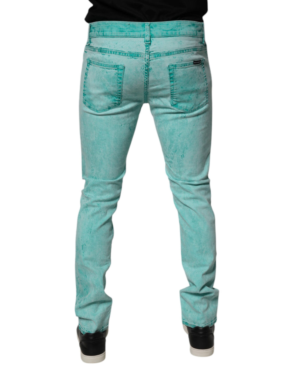 Jeans slim en coton tie-dye vert de Dolce & Gabbana pour homme, style décontracté avec coupe ajustée.