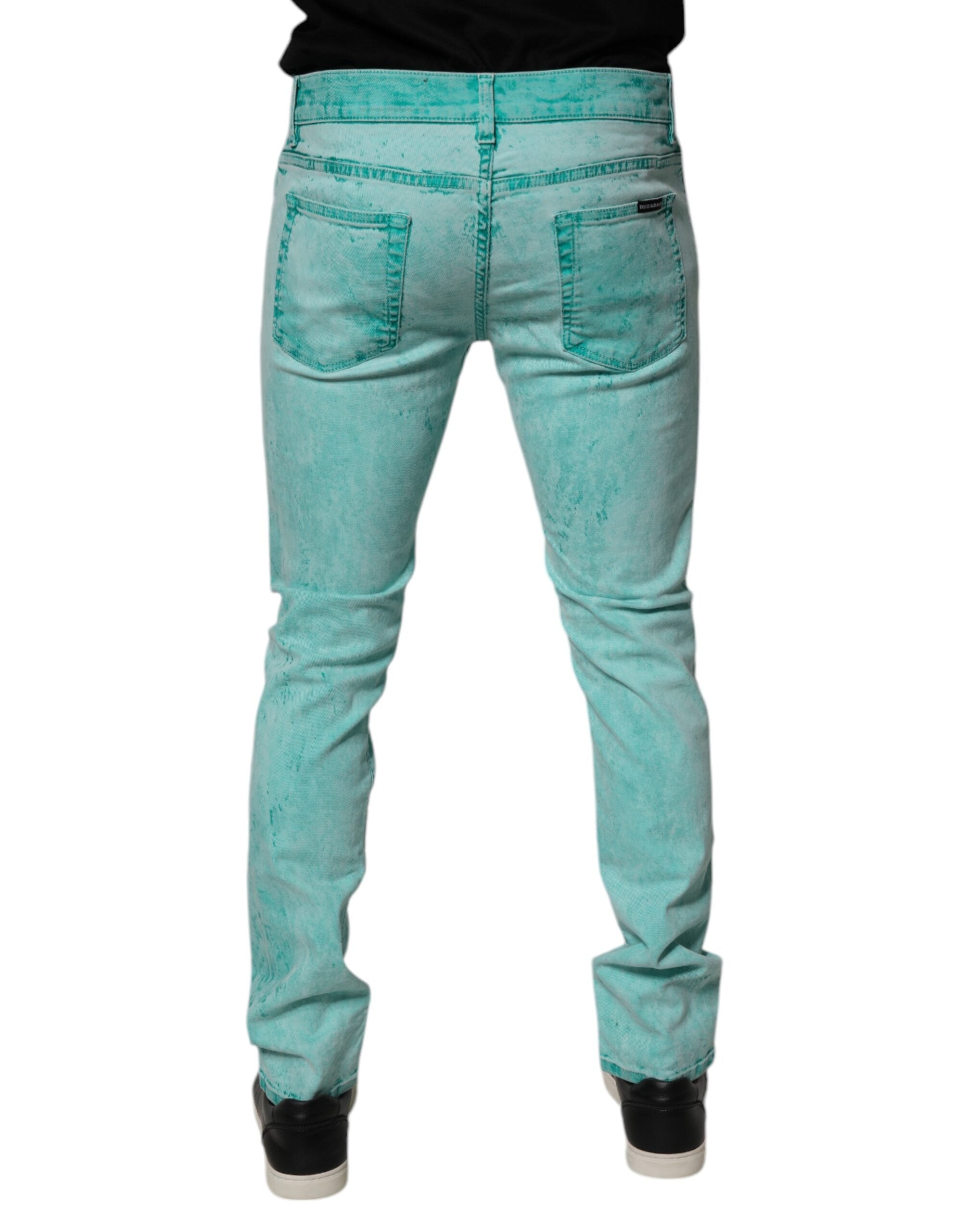 Jeans slim en coton tie-dye vert de Dolce & Gabbana pour homme, style décontracté avec coupe ajustée.