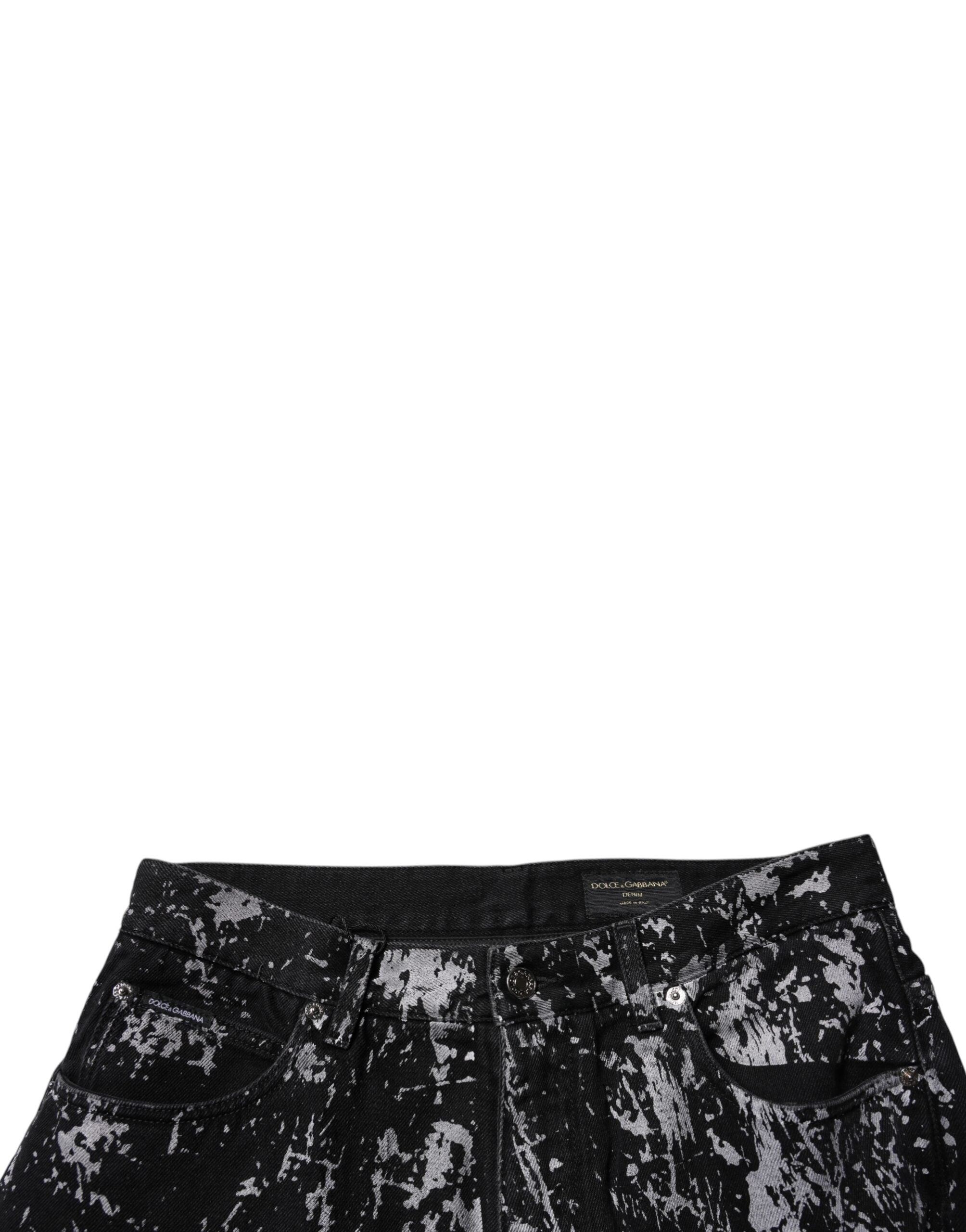 Jeans homme Dolce & Gabbana en coton noir tie-dye, coupe droite, denim tendance avec détails visibles.