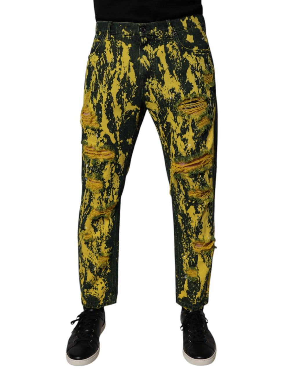 Jeans skinny homme Dolce & Gabbana en denim noir et jaune tie-dye avec déchirures et style tattered, mode moderne et tendance.