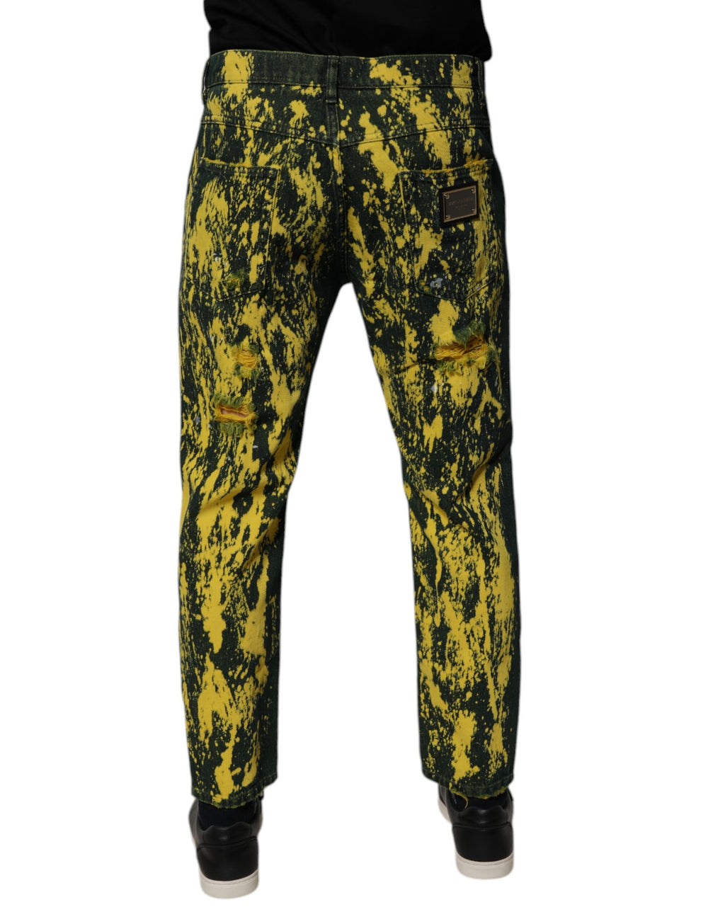 Jeans skinny en denim noir et jaune avec effet tie-dye et déchirures de Dolce & Gabbana, pour homme.