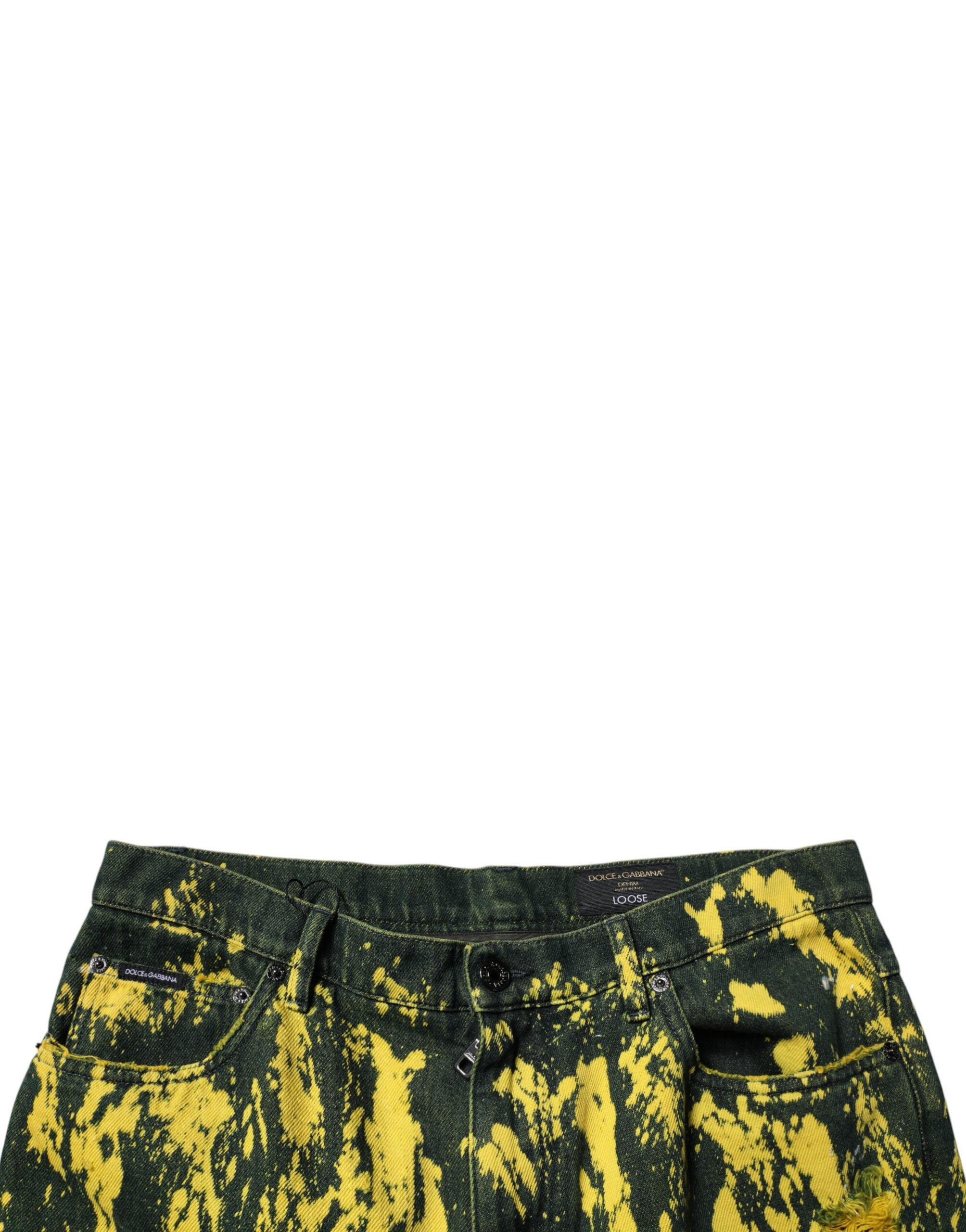 Pantalon en jean skinny homme Dolce & Gabbana noir et jaune tie-dye avec déchirures, style tattered, finition décontractée.