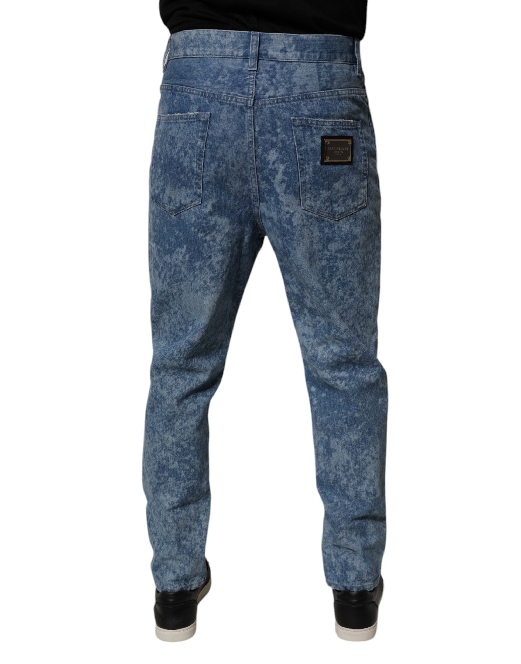 Jeans homme skinny en coton tie-dye bleu de Dolce & Gabbana, denim avec ceinture et détails tendance.