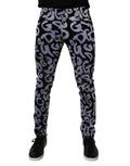 Jeans skinny en denim noir Dolce & Gabbana avec logo monogramme en coton, vue de face sur mannequin.