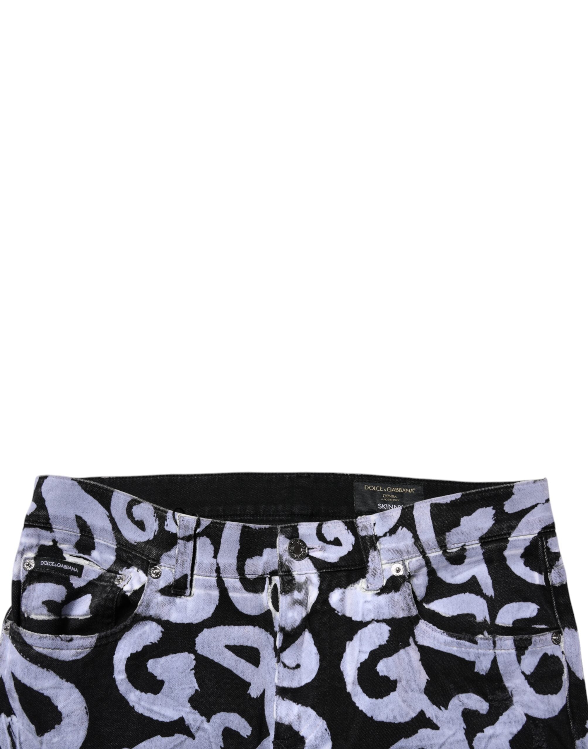 Jeans skinny en denim noir Dolce & Gabbana avec logo monogramme en coton, illustration de la coupe ajustée et du design élégant.