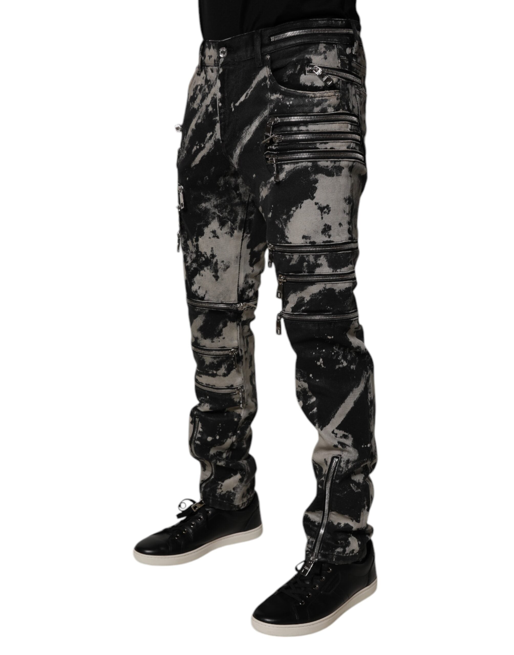 Jeans skinny en coton à effet tie-dye noir de Dolce & Gabbana avec zip, denim ajusté et style tendance.