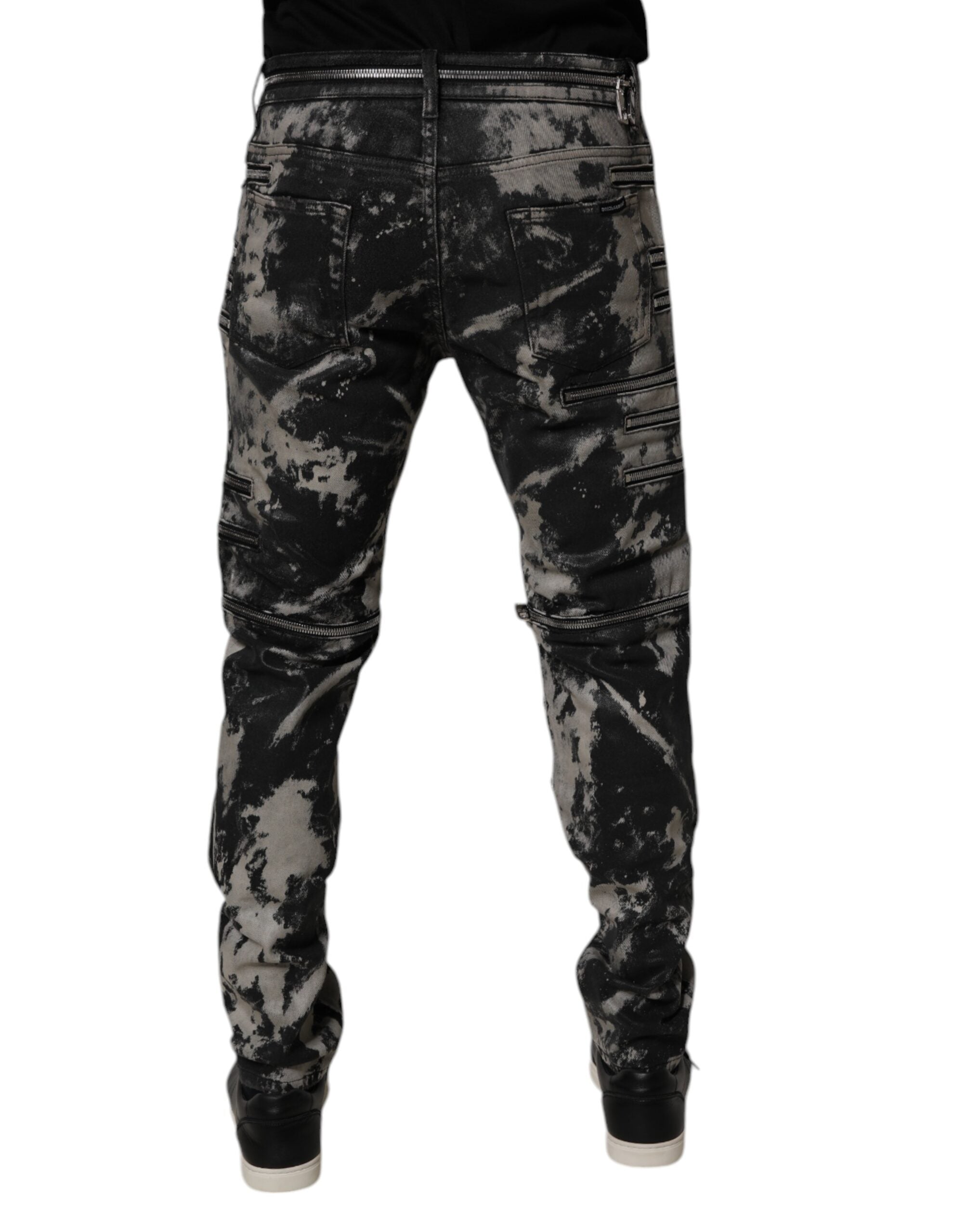 Jeans slim en denim noir tie-dye en coton de Dolce & Gabbana avec fermeture éclair et taille ajustée.