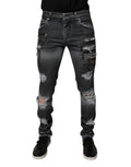 Jean skinny en denim gris foncé Dolce & Gabbana avec déchirures et coupe ajustée, en coton.