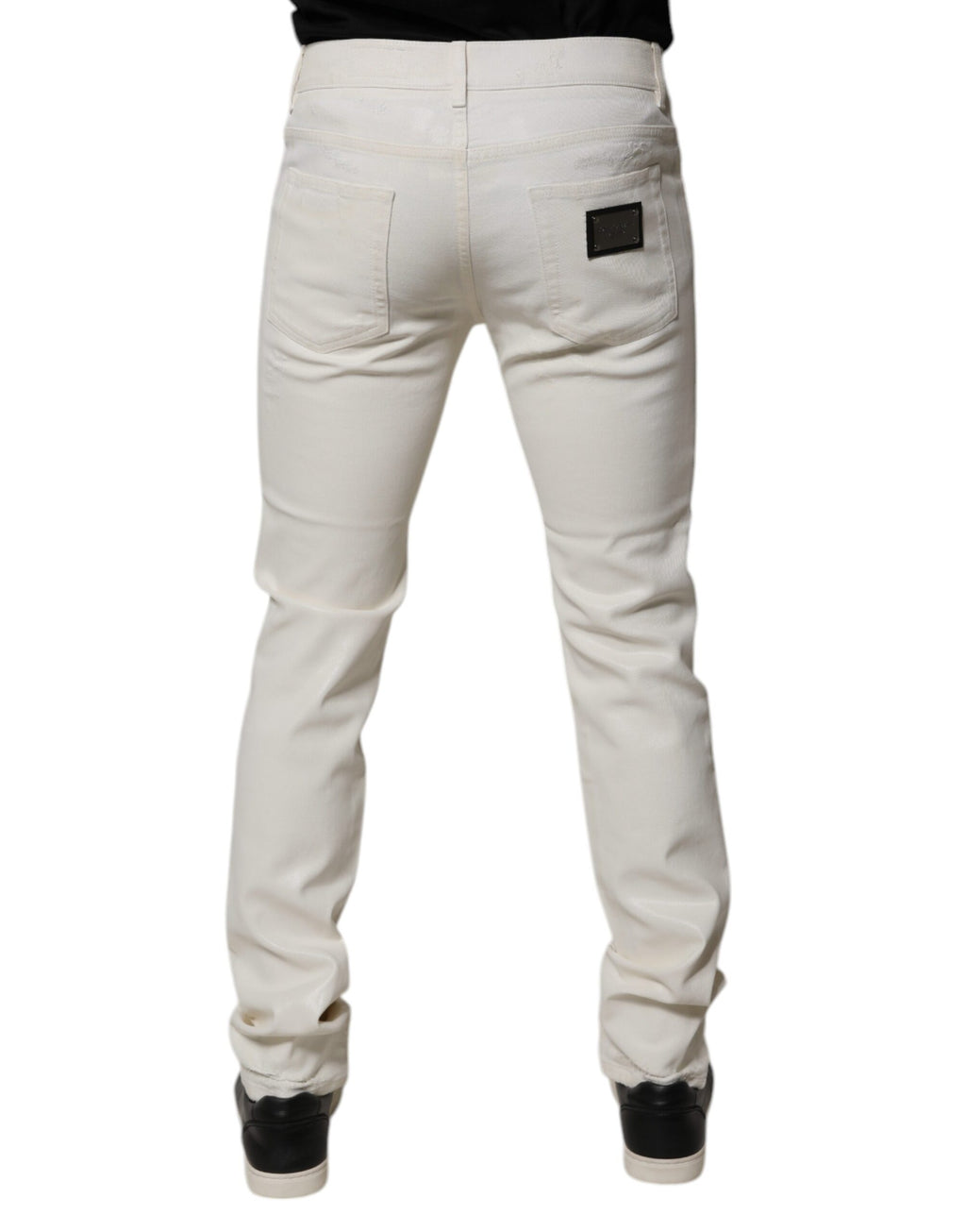 Jeans skinny en denim stretch blanc en coton de Dolce & Gabbana, coupe ajustée et moderne, visible en détail sur l'image.