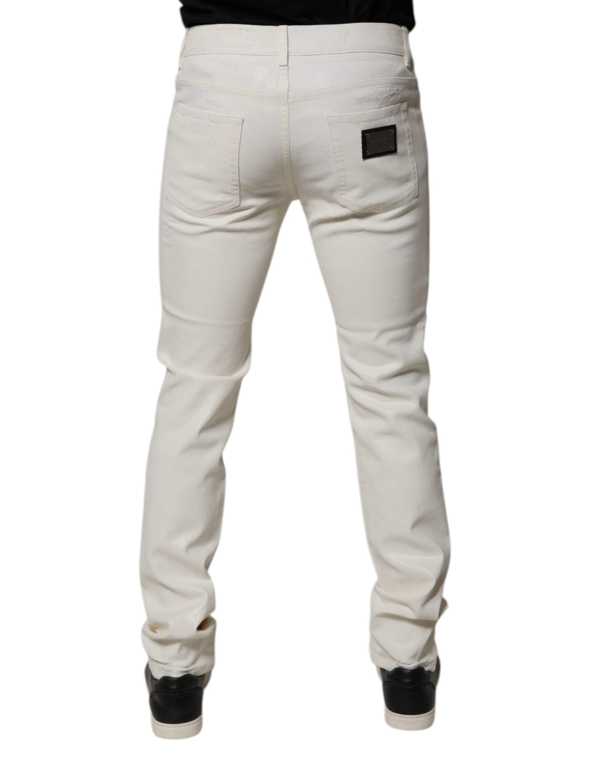 Jeans skinny en denim stretch blanc en coton de Dolce & Gabbana, coupe ajustée et moderne, visible en détail sur l'image.