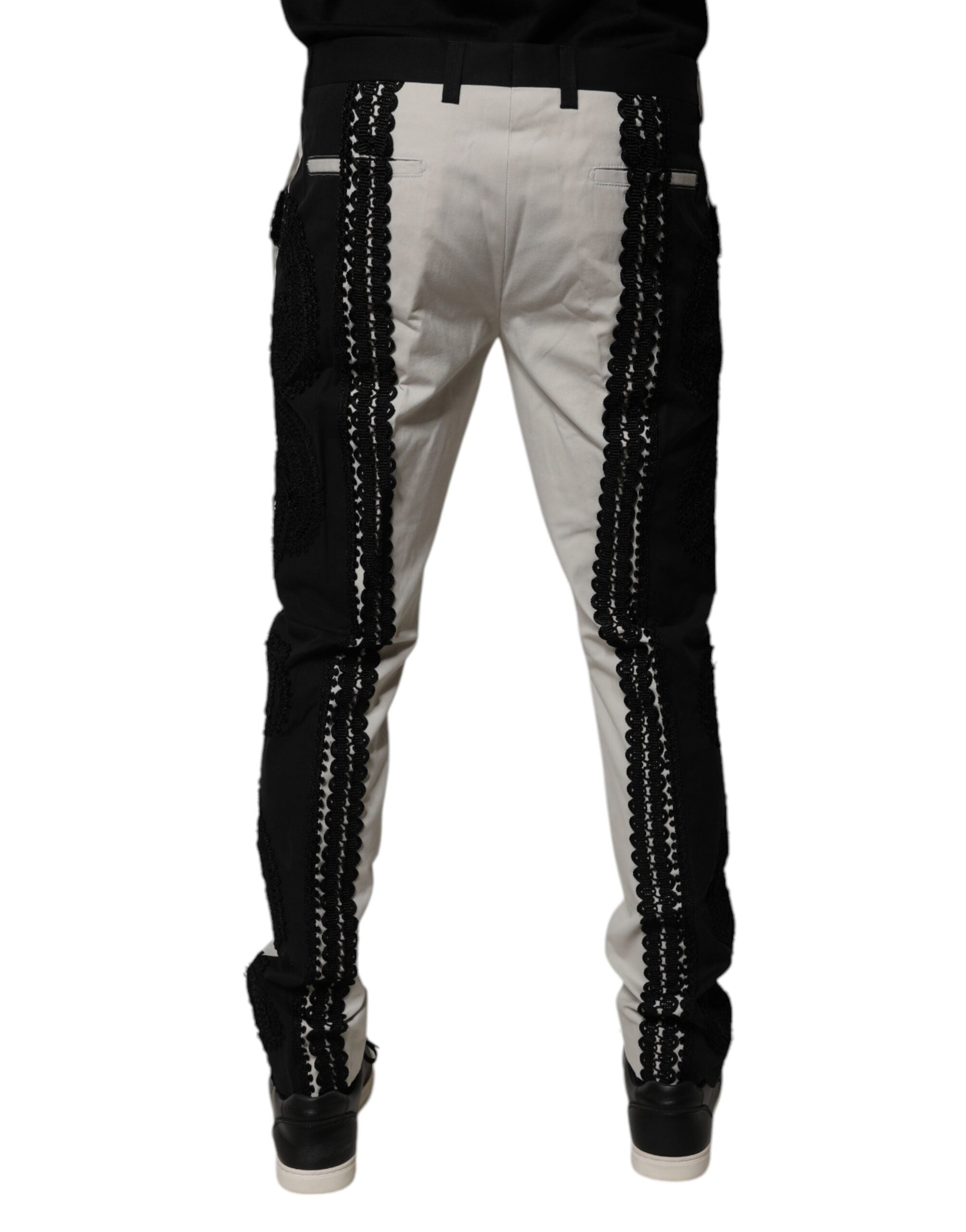 Pantalon formel Dolce & Gabbana blanc en dentelle, taille mi-hauteur, avec détail de couture élégante.