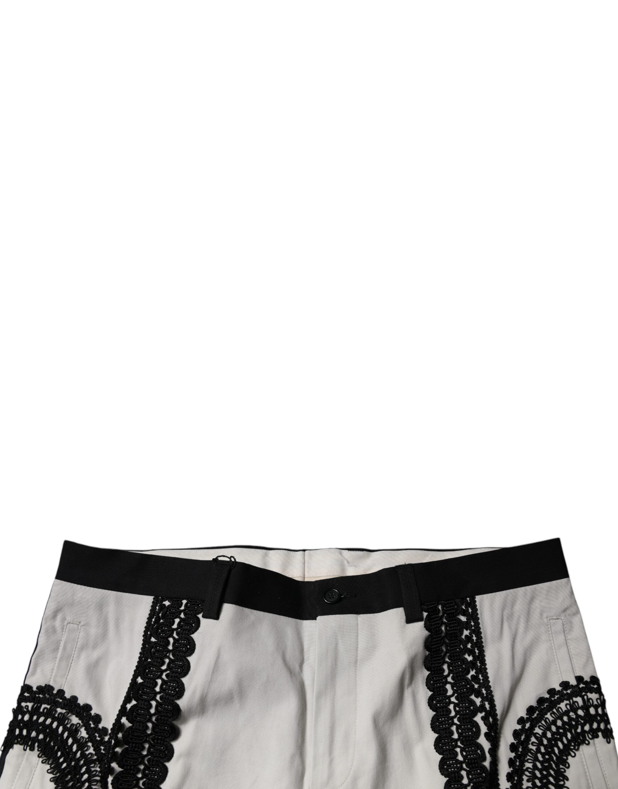 Pantalon formel Dolce & Gabbana blanc avec ourlet en dentelle, taille mi-haute, style élégant et sophistiqué.