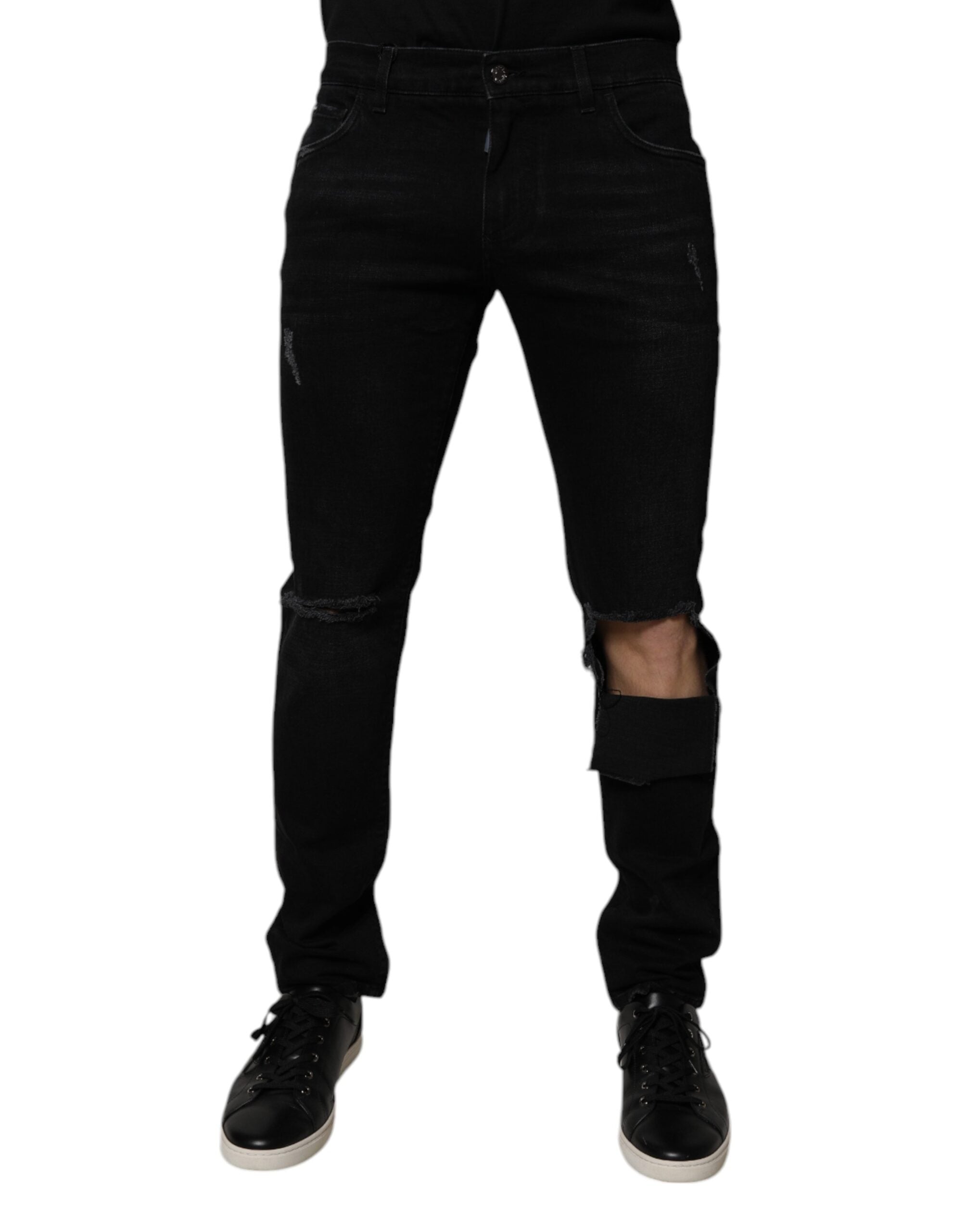 Jeans hommes skinny en coton noir déchiré de Dolce & Gabbana, style denim ajusté avec détails usés.