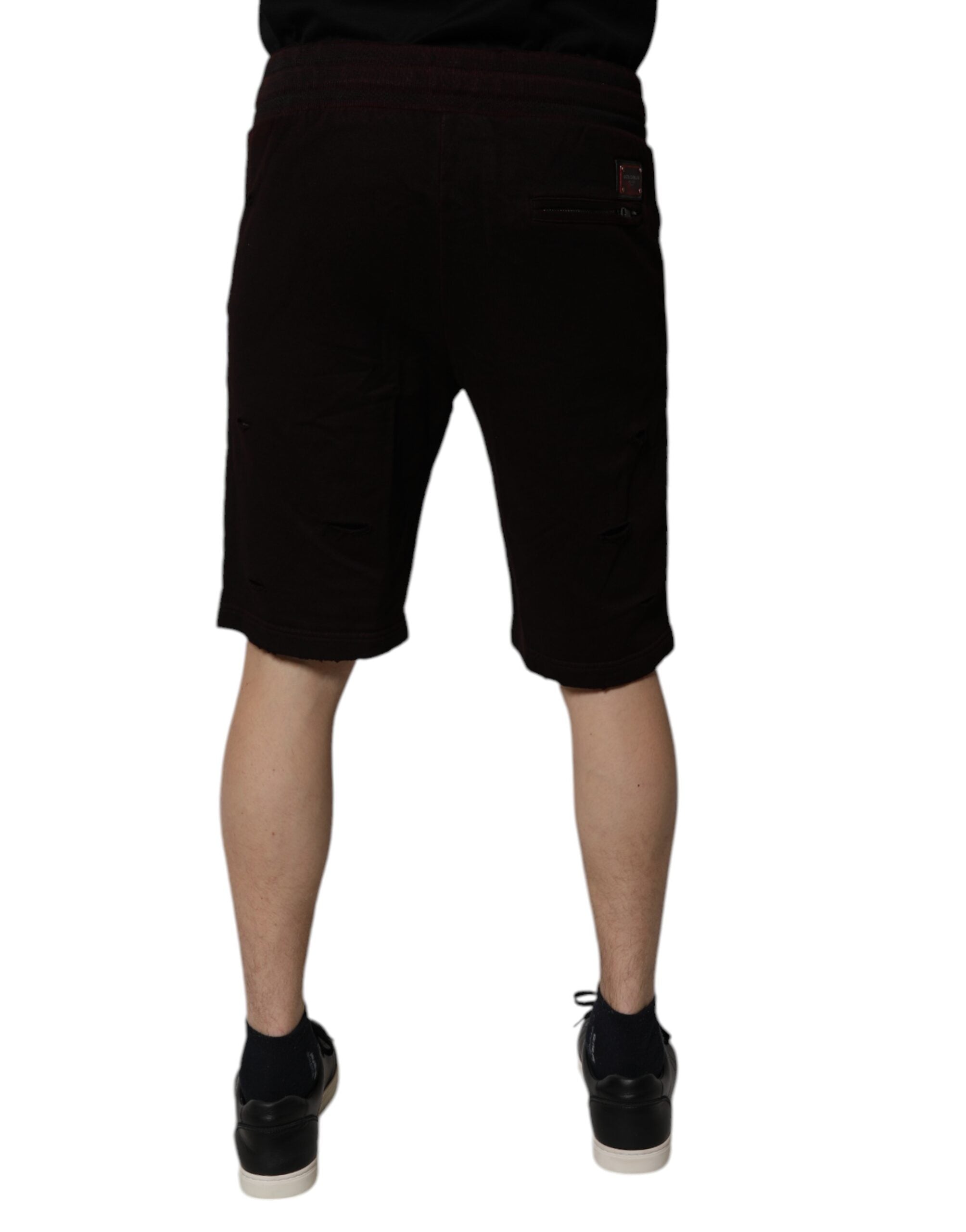 Shorts sweat en coton marron pour homme de Dolce & Gabbana, bermuda confortable et élégant, visibles en image.
