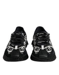 Chaussures sneakers basses noires Dolce & Gabbana avec logo en dentelle et laçage, style décontracté et moderne.