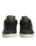 Baskets Dolce & Gabbana en cuir noir avec cœurs rouges et détails dorés, style sneakers élégants et modernes.