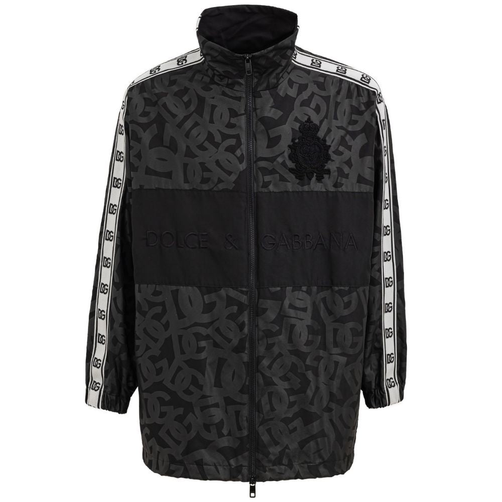 Veste en polyester noire Dolce & Gabbana, coupe moderne, avec détails de style élégant et finition soignée visible sur l'image.