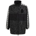 Veste en polyester noire Dolce & Gabbana, coupe moderne, avec détails de style élégant et finition soignée visible sur l'image.