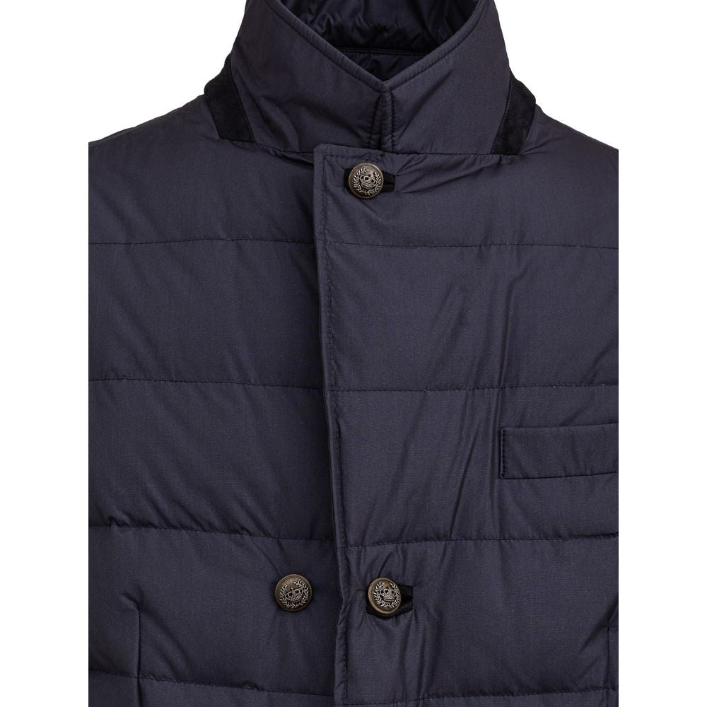 Manteau en polyester bleu Dolce & Gabbana, style élégant, visible avec col et boutons, porté ou suspendu.